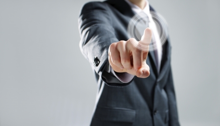 Businessman pressing virtual media type of buttonsの写真素材