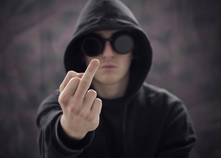 young guy showing the  middle fingerの写真素材