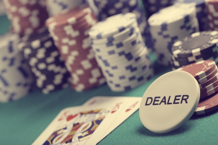 Casino poker chips with a dealer button.の写真素材