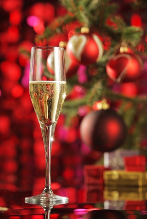 Glass of champagne with Christmas decorationsの写真素材