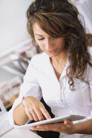 Handsome businesswoman  using his digital tablet 