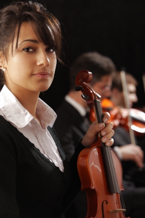 Classical music concert: Portrait of young woman violinistの写真素材