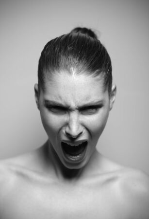 Beautiful woman shouting angry, shallow deep of fieldの写真素材