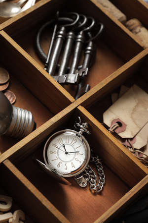 close up of old objects in a drawer with compartmentsの写真素材