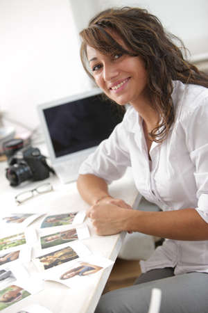 young photographer loves her job, she smiles looking