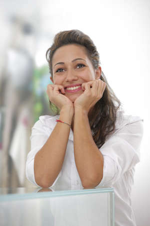 Young brunette businesswoman smiling at the camera の写真素材