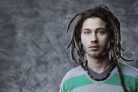 Portrait of Young cool man with dreadlocks の写真素材