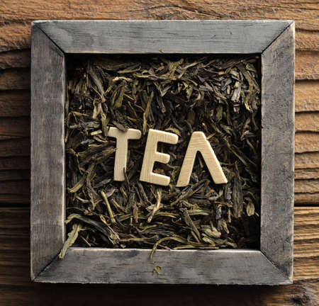 Pile of jasmine green tea in a wooden boxの写真素材