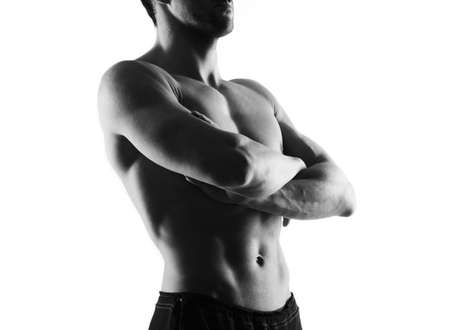 Handsome man with crossed arm on white backgroundの写真素材
