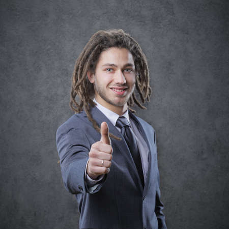 Happy businessman showing his thumb upの写真素材