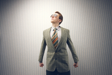 businessman old-fashioned, proud posing as supermanの写真素材