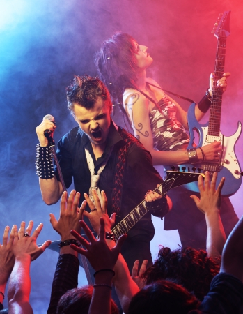 Rock band performing on stageの写真素材
