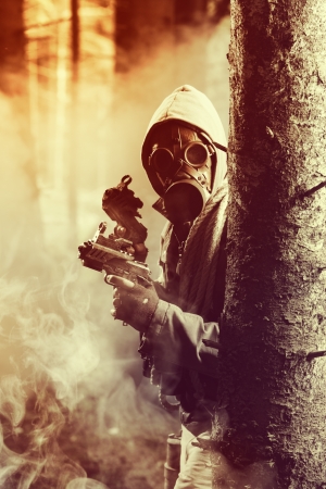 Soldier wearing a gas mask is fighting for its survivalの写真素材