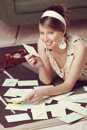 Attractive girl with Valentine card or loveletter