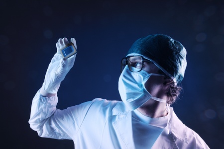 Computer engineer examining a microchip cpuの写真素材