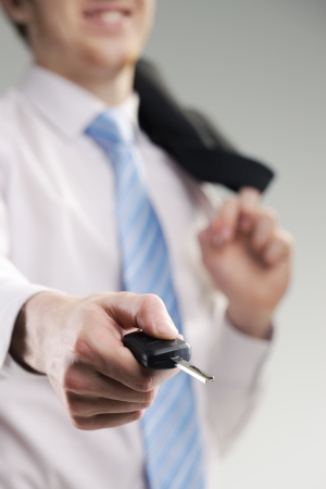 close up of a businessman hand with car keyの写真素材