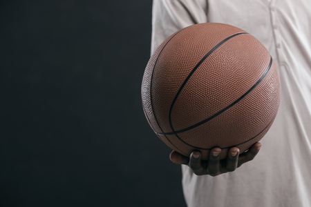 African boy holding a basket ball, hand close upの写真素材