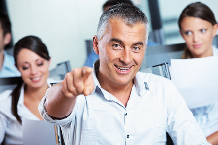 A mature business man pointing at you の写真素材