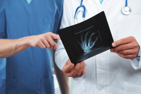 Close up shot of Doctor and nurse looking at x rayの写真素材