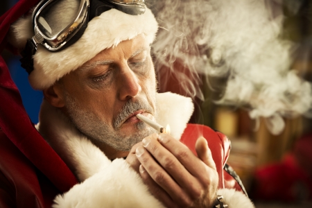 Portrait of Bad Santa smoking a jointの写真素材