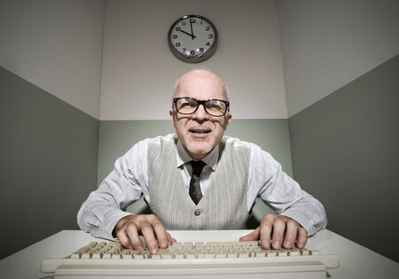 Vintage office worker typing on a computer keyboard.の写真素材