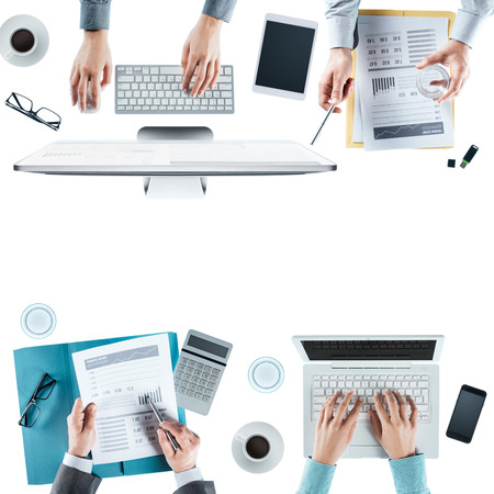 Business team working at office desk top view, blank copy space, unrecognizable peopleの写真素材