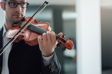 Talented violinist and classical music player solo performance, blank copy space on rightの写真素材