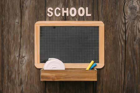 School vintage blackboard with chalk on a wooden desk, back to school conceptの写真素材