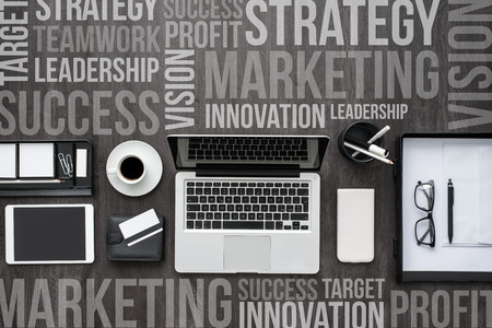 Corporate business desktop with laptop, digital tablet, accessories and work equipment, flat lay...