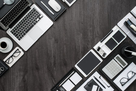 Business and management elegant black desktop with laptop, tablet and work equipment, flat lay,...