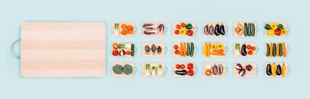 Fresh organic vegetables assortment on wooden chopping boards and copy space: healthy eating and...