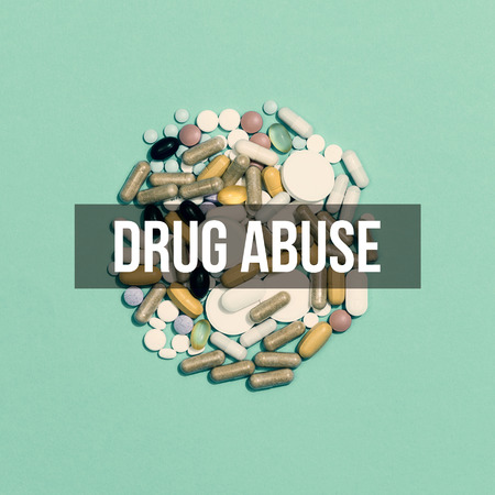 Prescription medicines and drugs abuse: a lot of assorted pills and capsules on green backgroundの写真素材