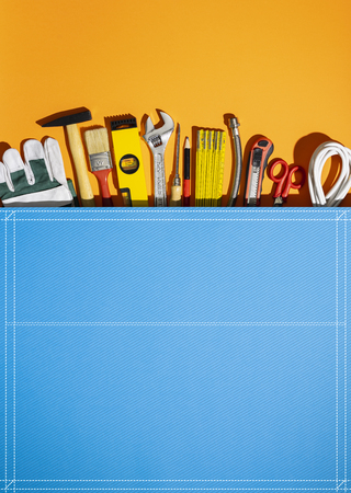 Huge pocket with set of DIY and home renovation tools, all in one service and toolkit conceptの写真素材