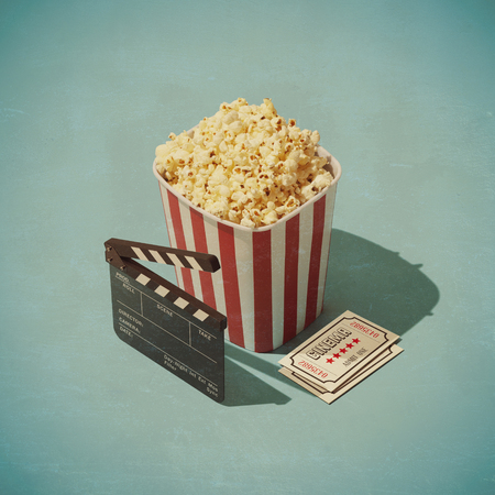 Cinema and entertainment: popcorn, clapperboard and movie theater ticketsの写真素材