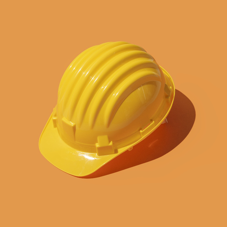 Plastic safety helmet: work safety and construction industry conceptの写真素材