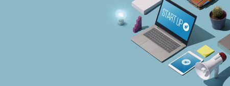 Start up brand launch on laptop and mobile devices: business and marketing solutions, blank copy spaceの写真素材