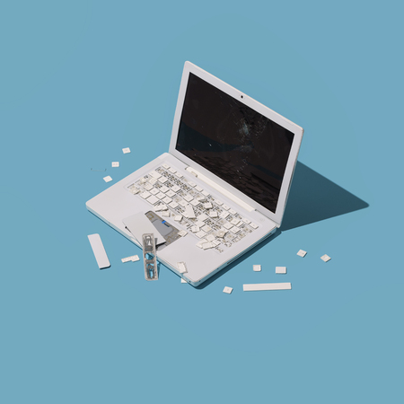 Smashed broken plastic laptop: frustration, rage and overwork concept