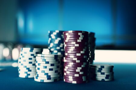 Piles of chips on the poker table, winning and casino conceptの写真素材