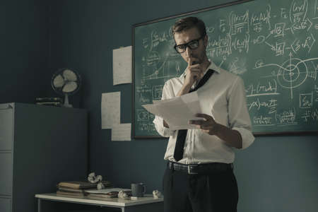 Confident mathematical researcher checking papers and studying new formulas in his office