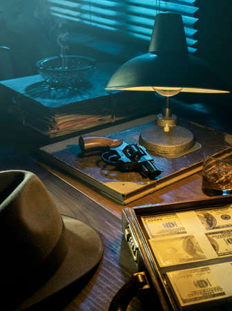 1950s film noir style desktop with revolver and cash money: crime, gangsters and thriller conceptの写真素材