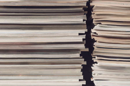 Stacks of magazines close up: printed media and information concept