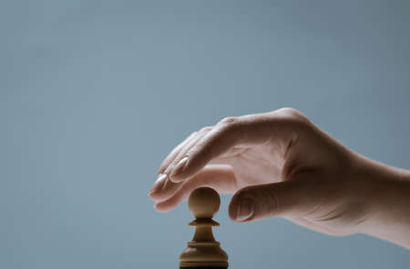 Professional chess player moving a piece, strategy and tactics games conceptの写真素材