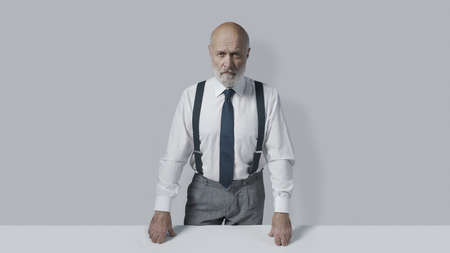 Confident business leader standing and looking at camera, leadership concept