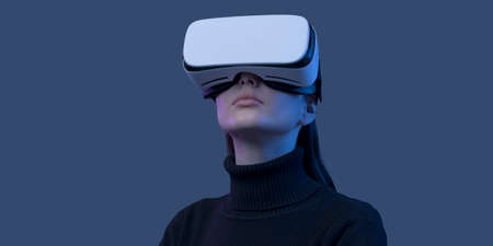 Young beautiful woman wearing a VR headset and experiencing virtual reality, futuristic technology...