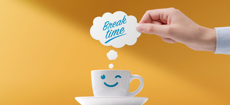 It's coffee break time with cute smiling character cupの写真素材