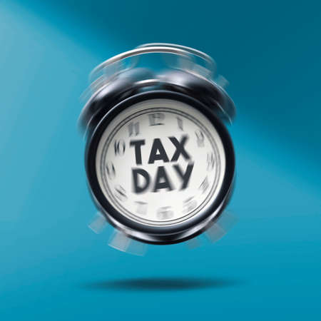 Vintage alarm clock ringing and reminding tax day, individual income tax returns conceptの写真素材
