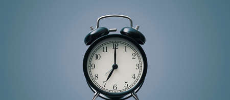 Vintage twin bell alarm clock, time and deadlines concept