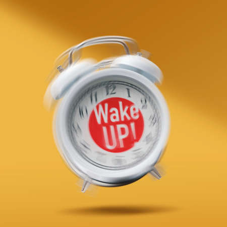 Funny vintage twin bell alarm clock ringing, wake up text in the displayの写真素材