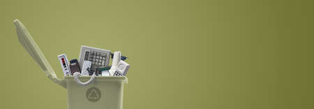 Waste bin full of electronics, e-waste and recycling conceptの写真素材