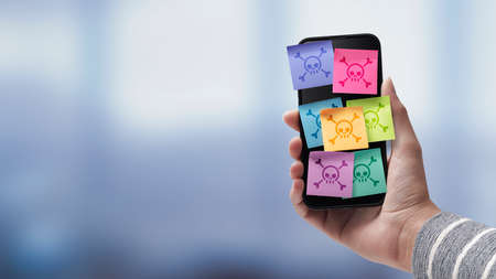 Hand holding a smartphone infected with viruses and malware, cybersecurity concept